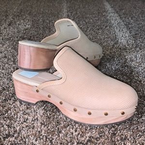 Brand new with tags size 6 clog shoes. Wooden heel gold accents on the side
